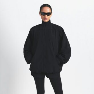 NikeSKIMS VÆVET NYLON OVERSIZED TRÆNINGSJAKKE