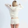 STRIKKET SWEATER MED KRYMPEDE LYNLÅS-HÆTTETRÆTTE